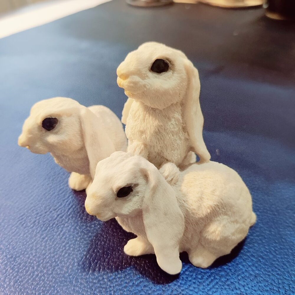 Set of 3 Holland Lop Eared Rabbits made of ceramic or resin. Stands 3.5"W x 5" L